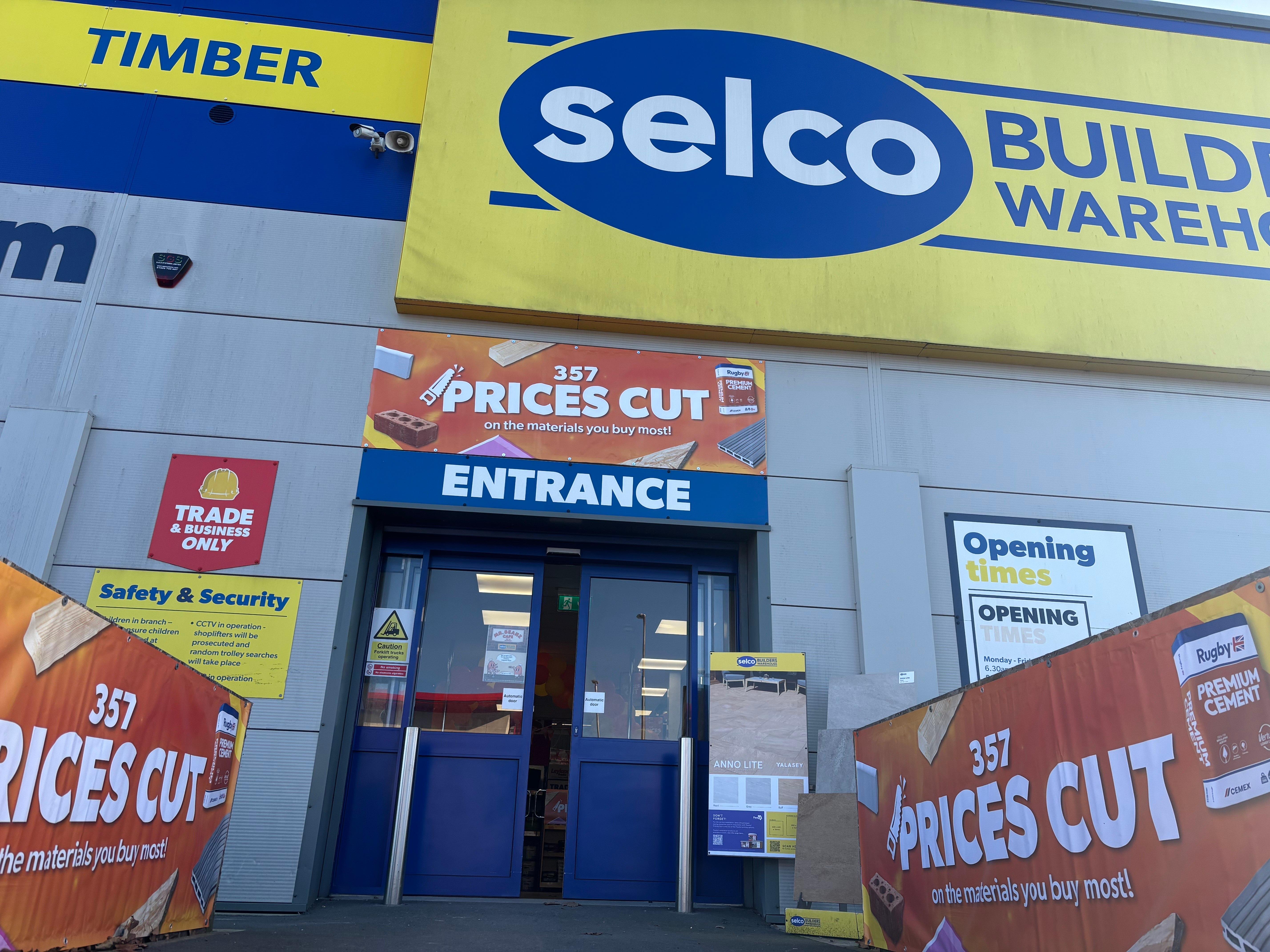 Selco store entrance with Price Cuts signs and posters