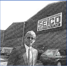 Man standing outside Selco Builders Warehouse in 1986