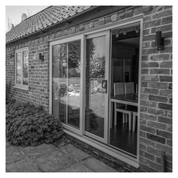 Crystal Clear Glazed Right to Left Grey/White uPVC Sliding Patio Door