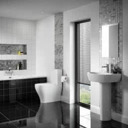 Bathroom suite with silver and black tiles