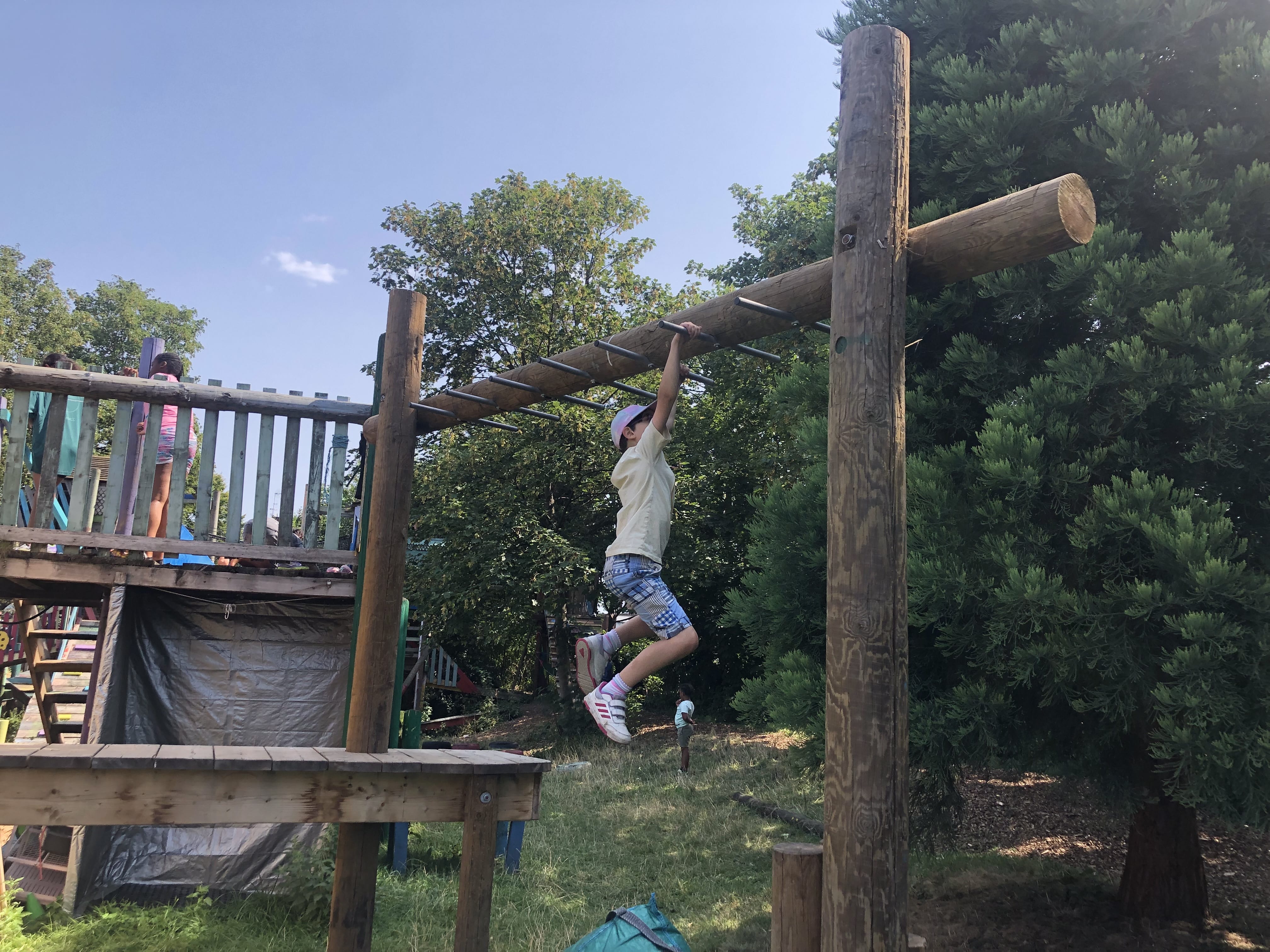 Child climbing on adventure playground
