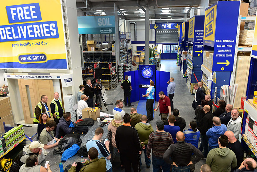 Darts pro Gerwyn Price takes on customers at Selco Builders Warehouse