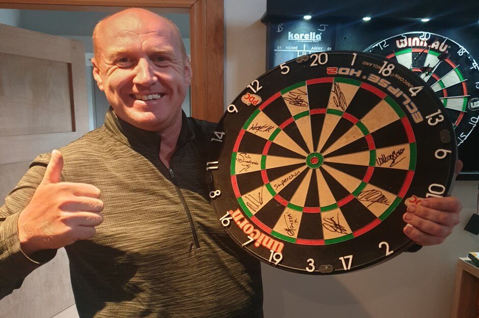 Auction winner with darts board.