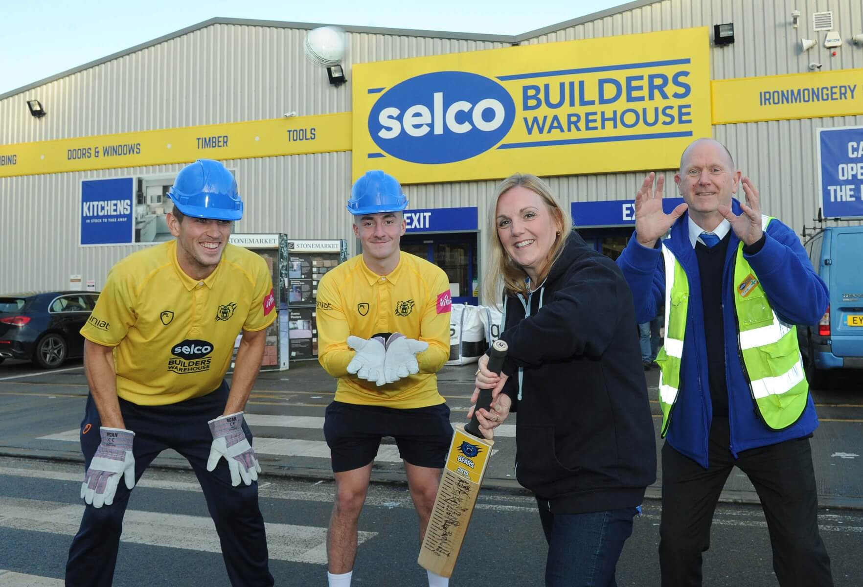 Penkridge players and Selco staff at a Selco branch.