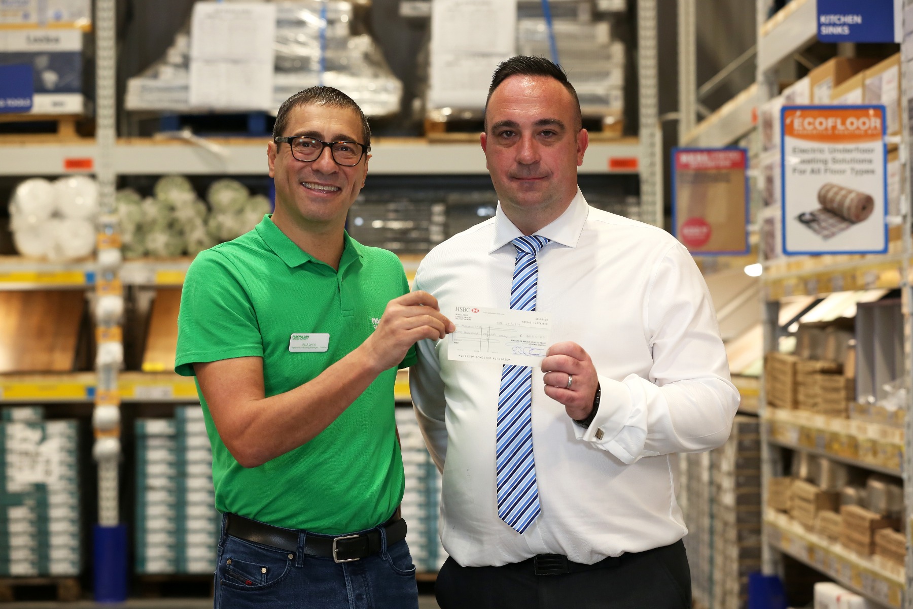 Selco presenting cheque to Macmillan
