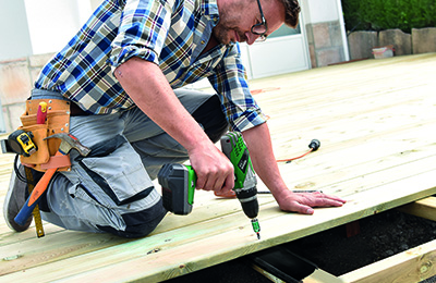 Man using SPAX decking screws